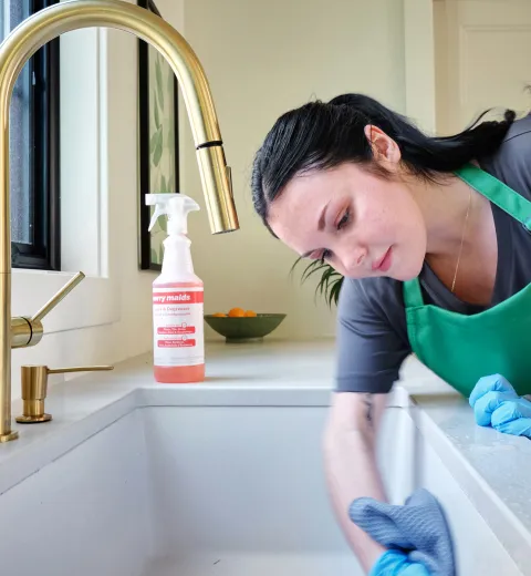 merry maid cleaning a kitchen sink